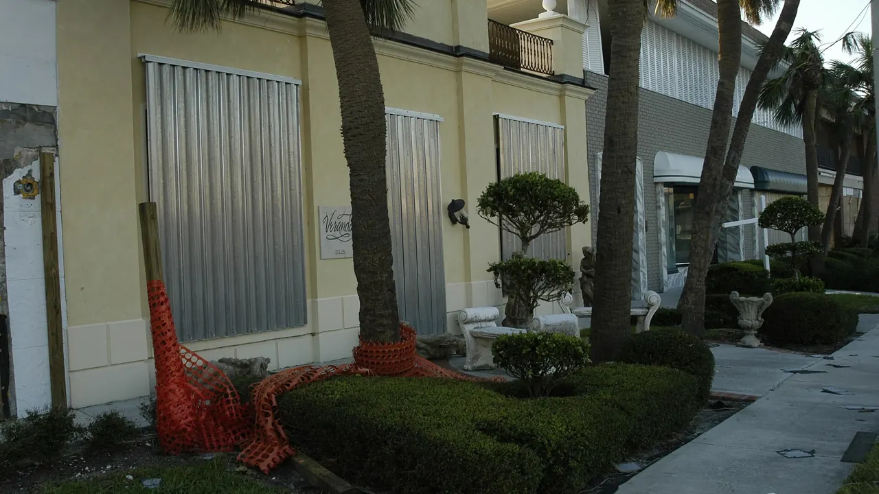 Storm panels installed over the windows of a home