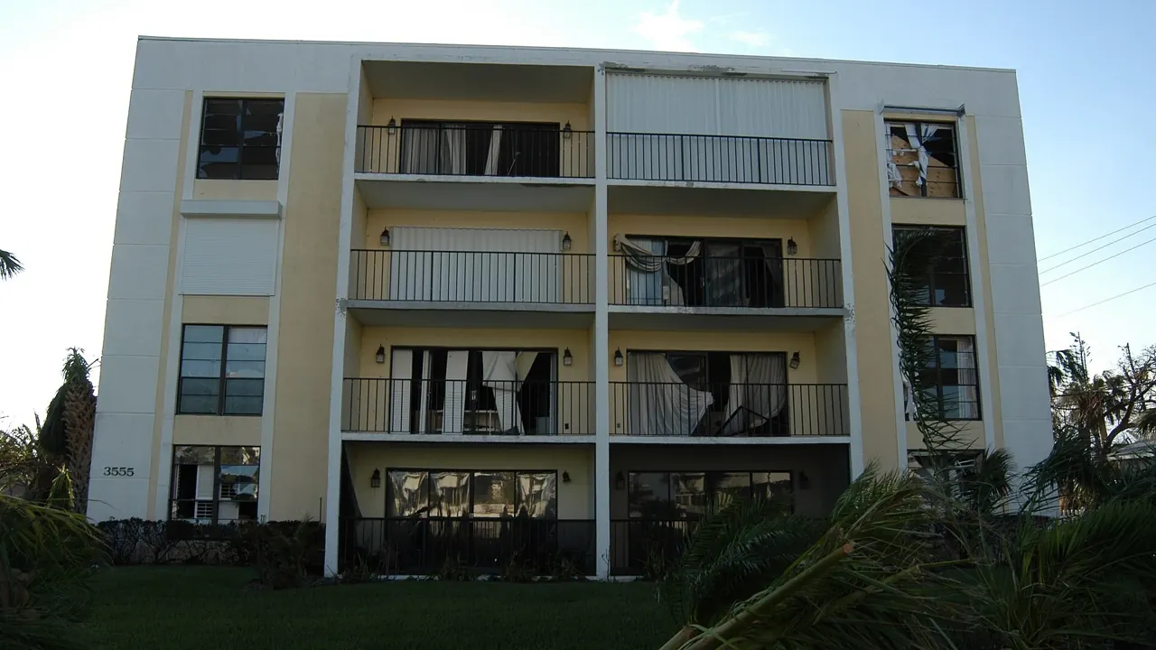 Condo building with hurricane shutters on its balconies