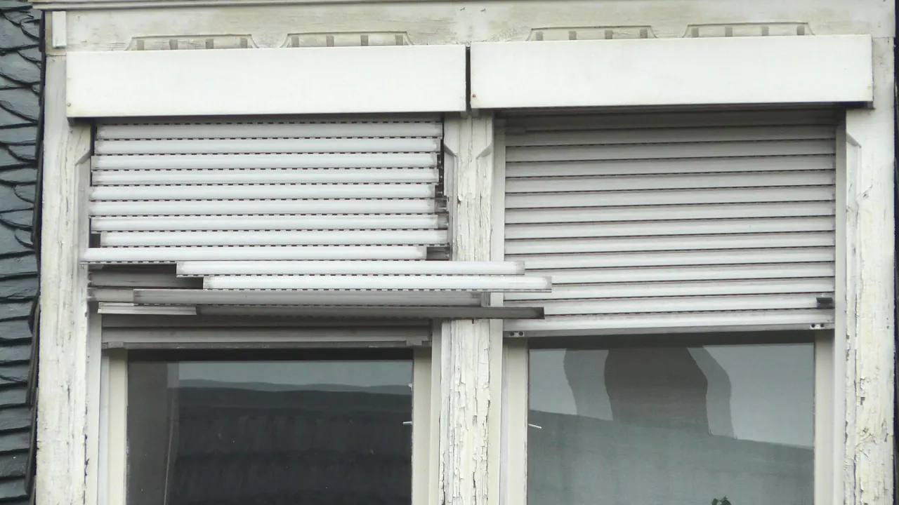 Roll-down shutter over a window