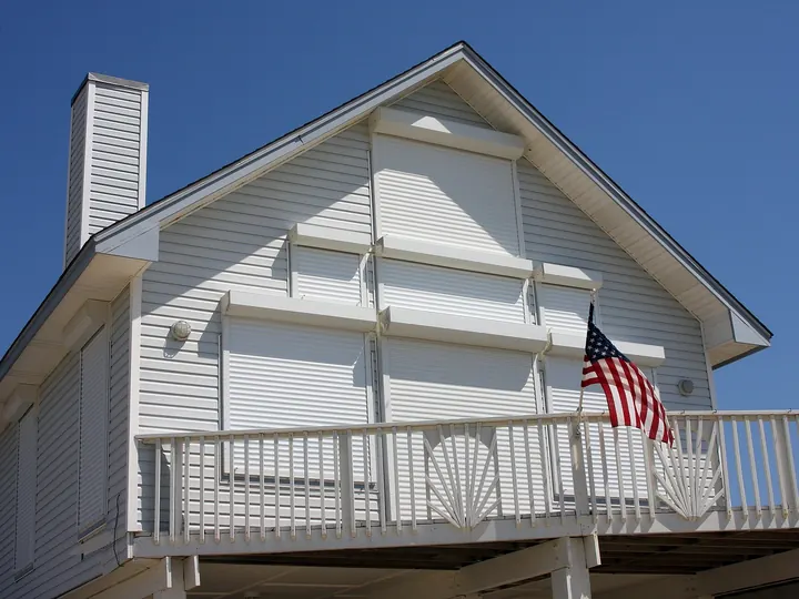 Coastal home with every window and door shuttered