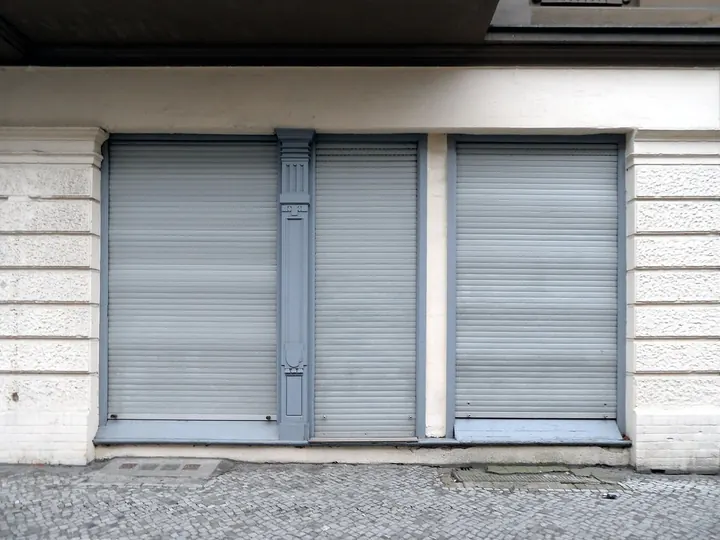 Roll-down shutter closed over a window
